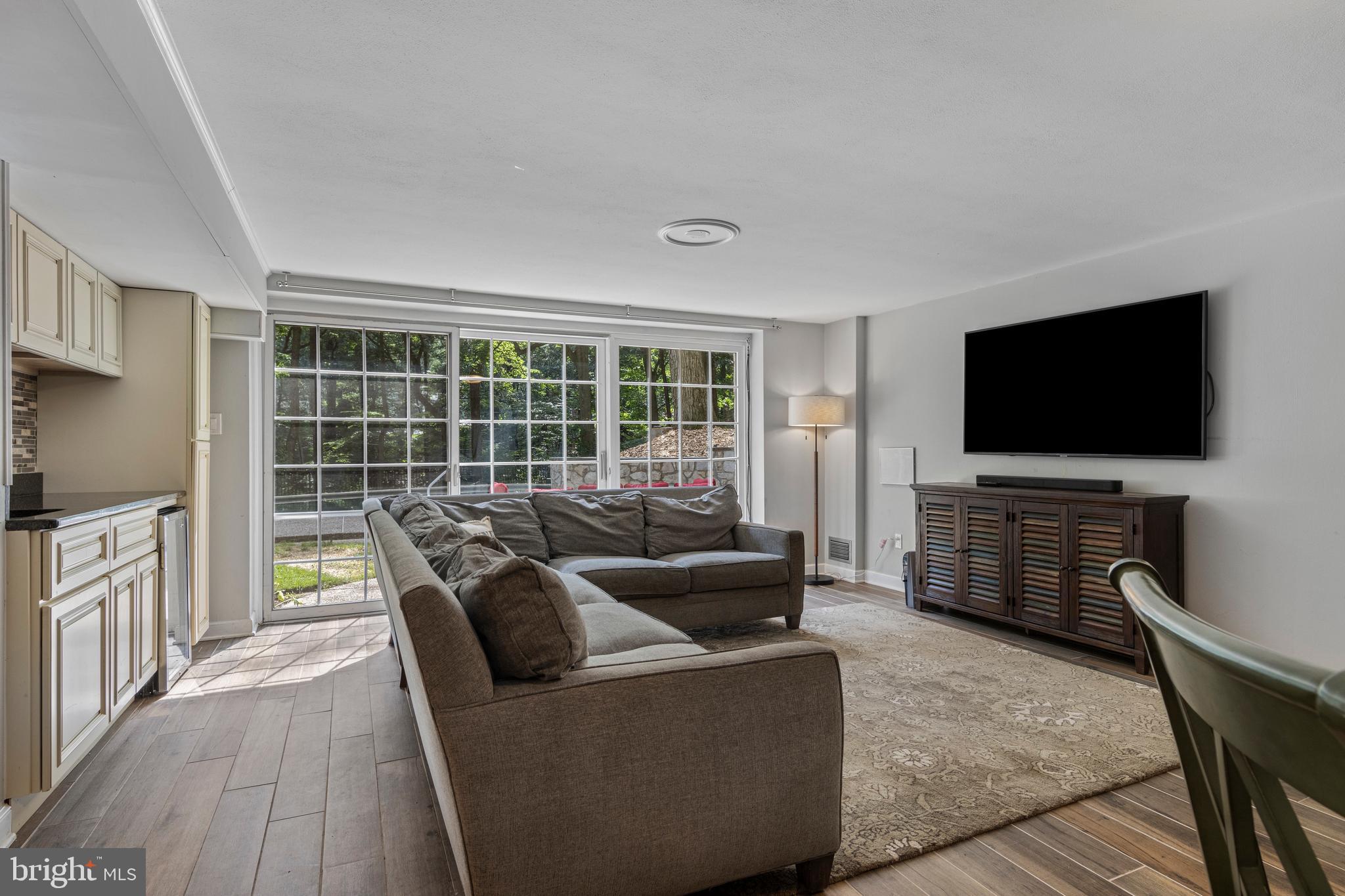 13 Weirwood Road Wayne, PA 19087 - Photo 53 of 61 a living room with furniture and a flat screen tv