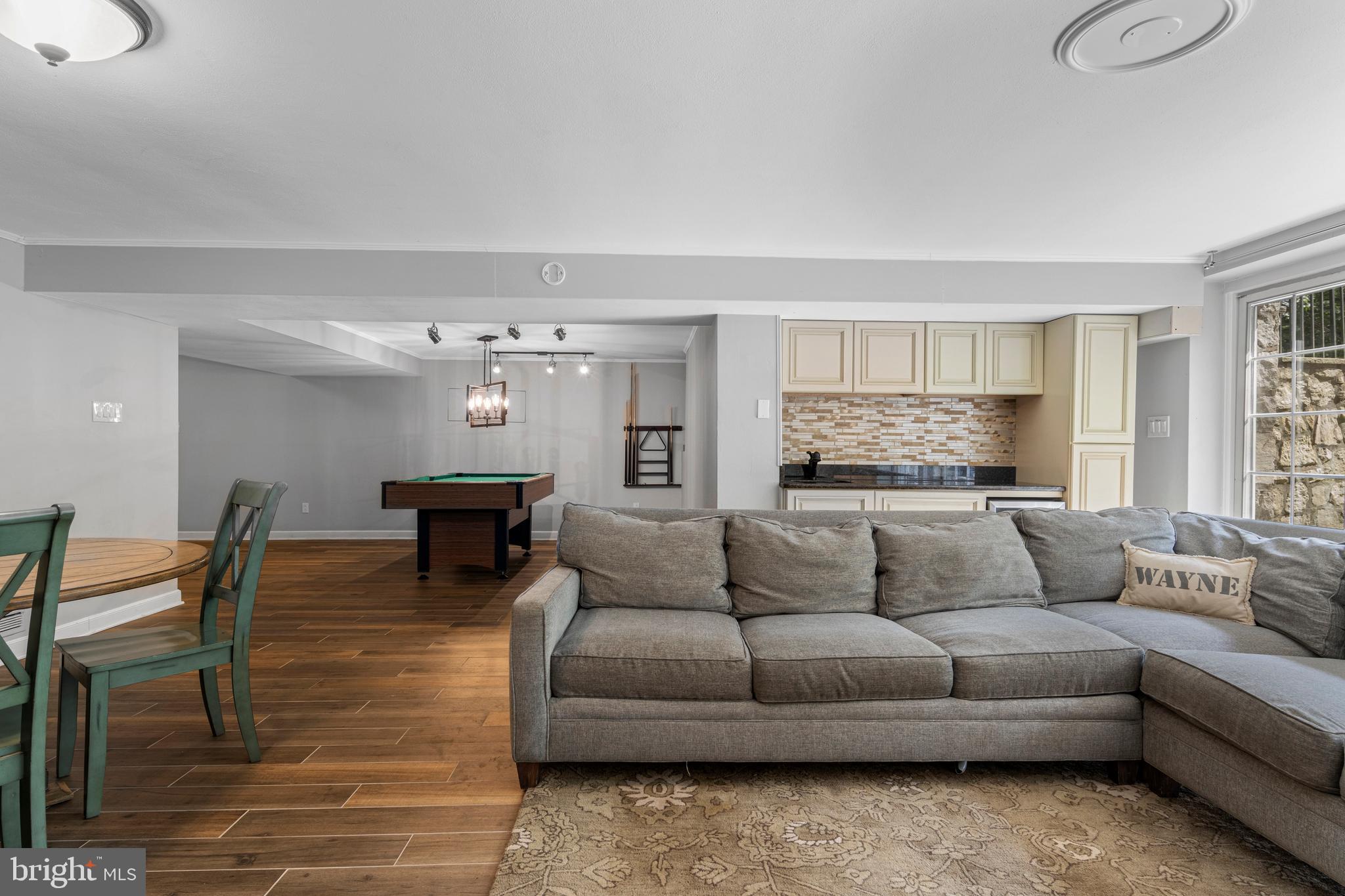 13 Weirwood Road Wayne, PA 19087 - Photo 54 of 61 a living room with furniture and a large window