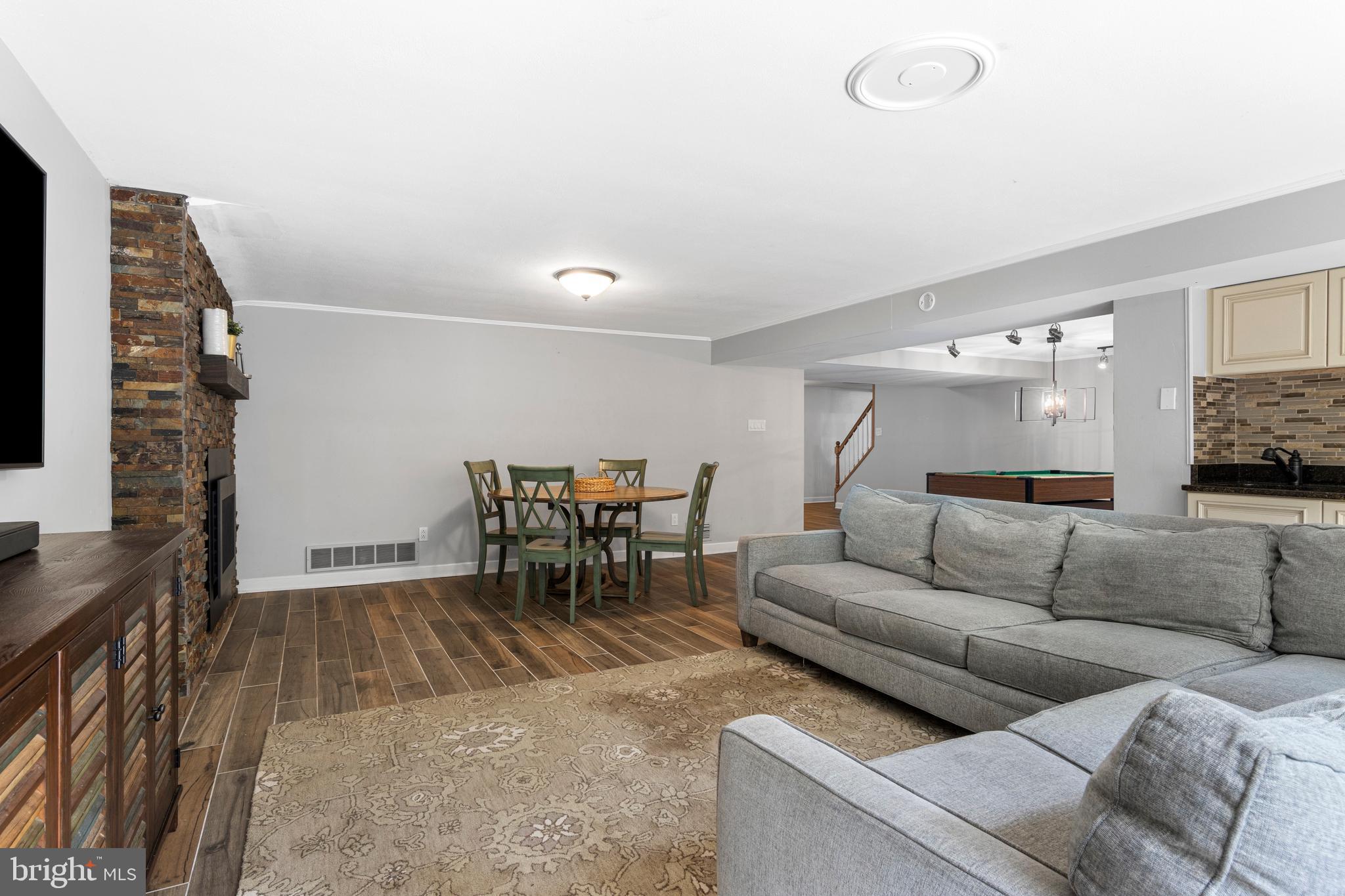 13 Weirwood Road Wayne, PA 19087 - Photo 56 of 61 a living room with furniture and a flat screen tv