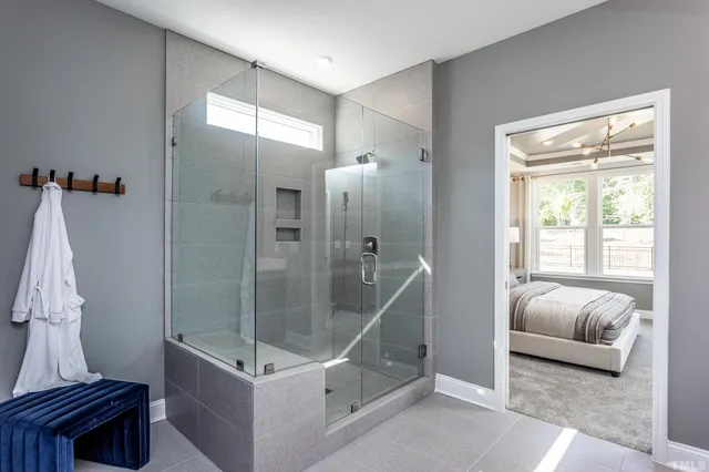 a spacious bathroom with a shower and a sink