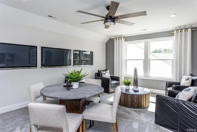 a view of a livingroom with furniture window and wooden floor
