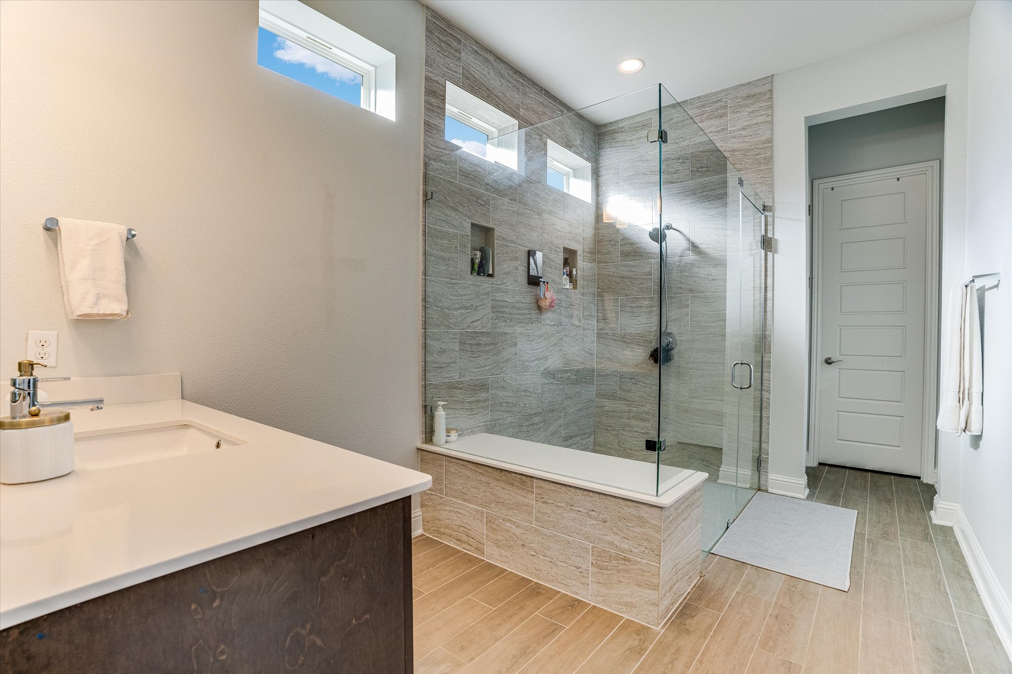 5205 Mandevilla Drive Austin, TX 78739 - Photo 13 of 20 a bathroom with a sink and shower