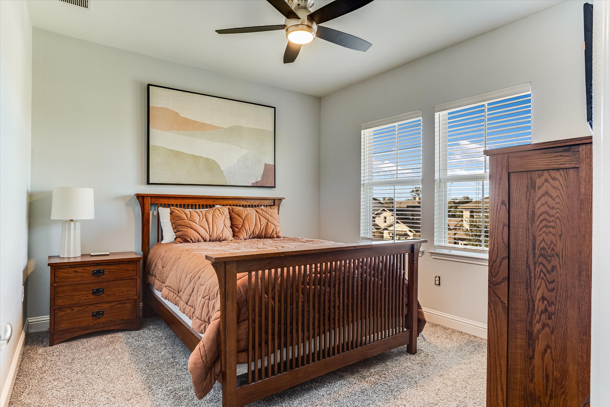 5205 Mandevilla Drive Austin, TX 78739 - Photo 16 of 20 a bedroom with a bed and window