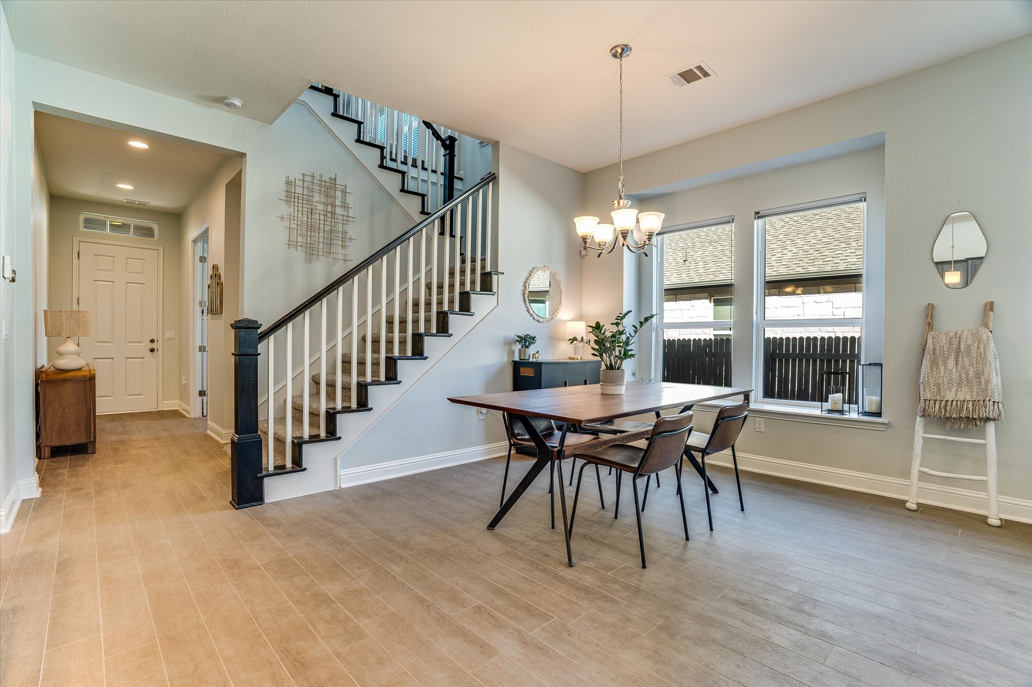 5205 Mandevilla Drive Austin, TX 78739 - Photo 4 of 20 a view of a dining room with furniture window and wooden floor