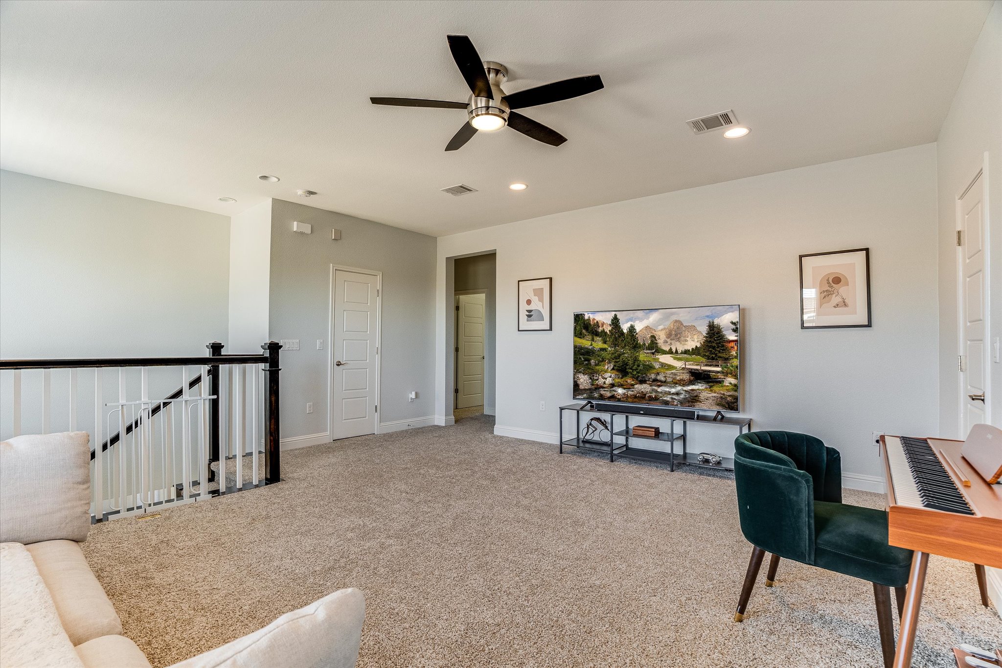 5205 Mandevilla Drive Austin, TX 78739 - Photo 6 of 20 a living room with furniture and a flat screen tv