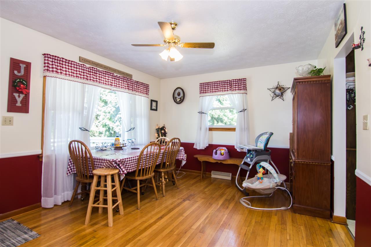 4357 Martin Miller Road Dayton, VA 22821 - Photo 8 of 28 a dining room with furniture a chandelier and wooden floor