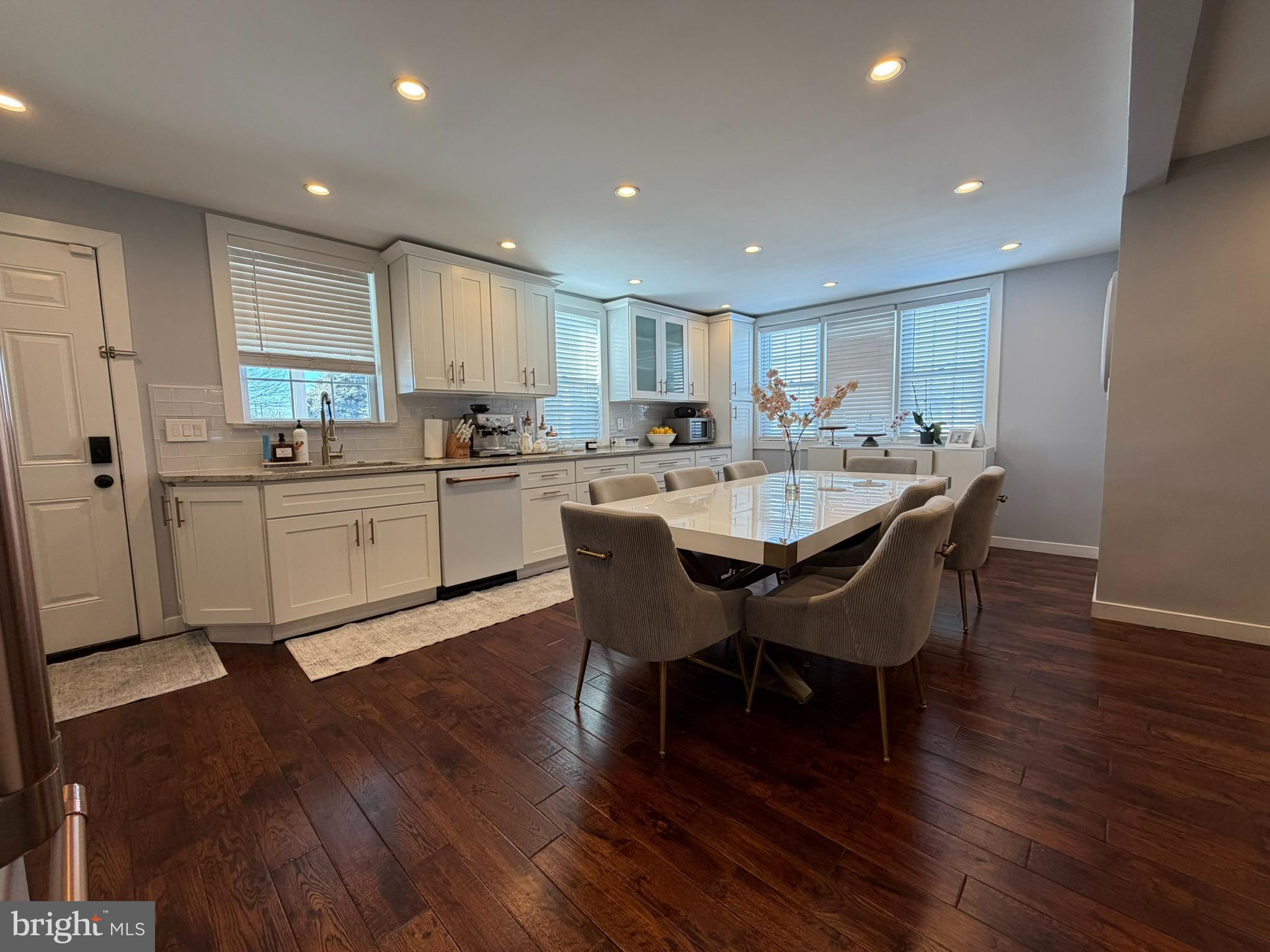 8101 Large Street Philadelphia, PA 19152 - Photo 11 of 30 a kitchen with a dining table chairs and wooden floor
