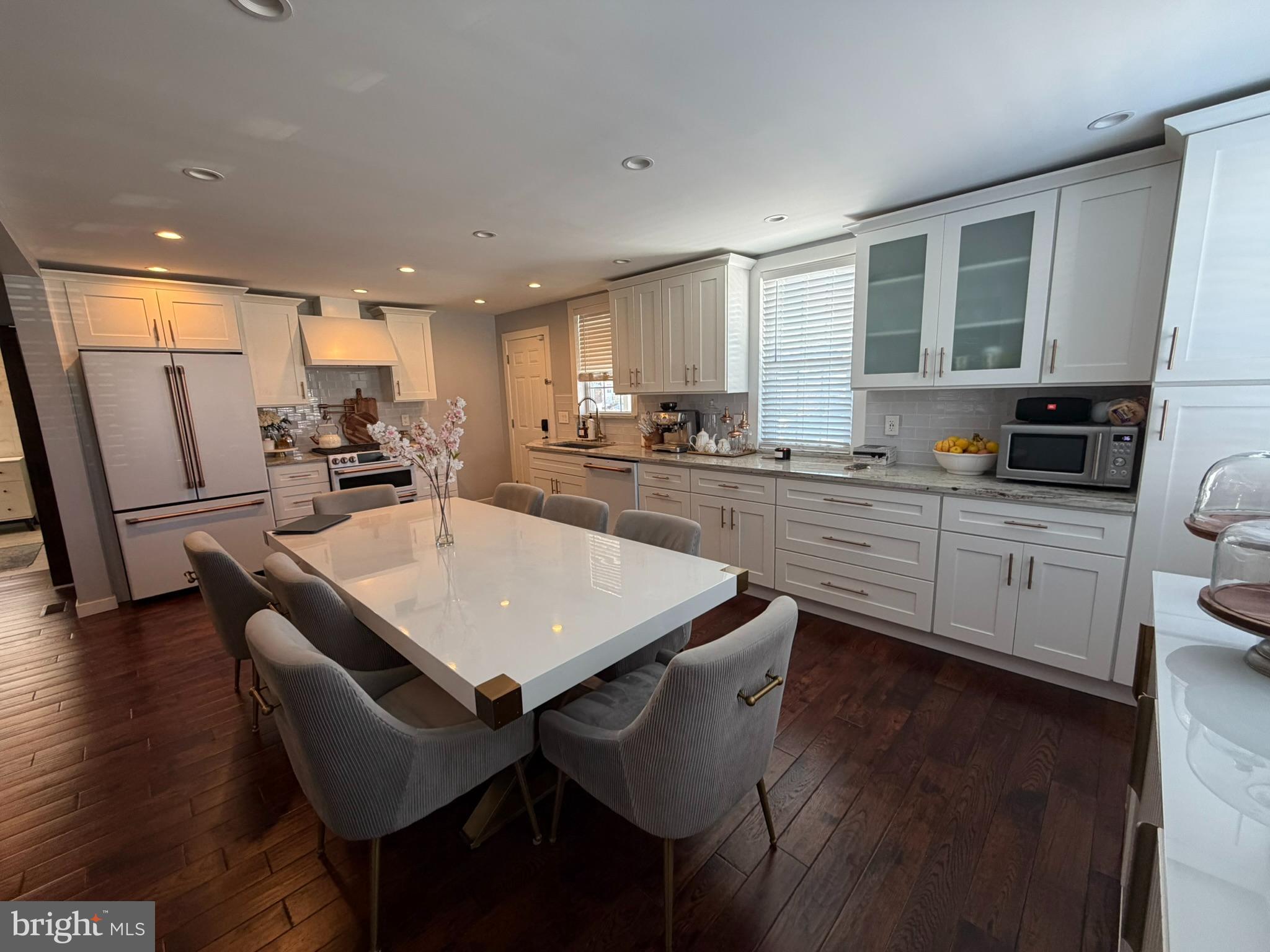 8101 Large Street Philadelphia, PA 19152 - Photo 13 of 30 a kitchen with stainless steel appliances granite countertop a sink a stove a refrigerator cabinets and a dining table