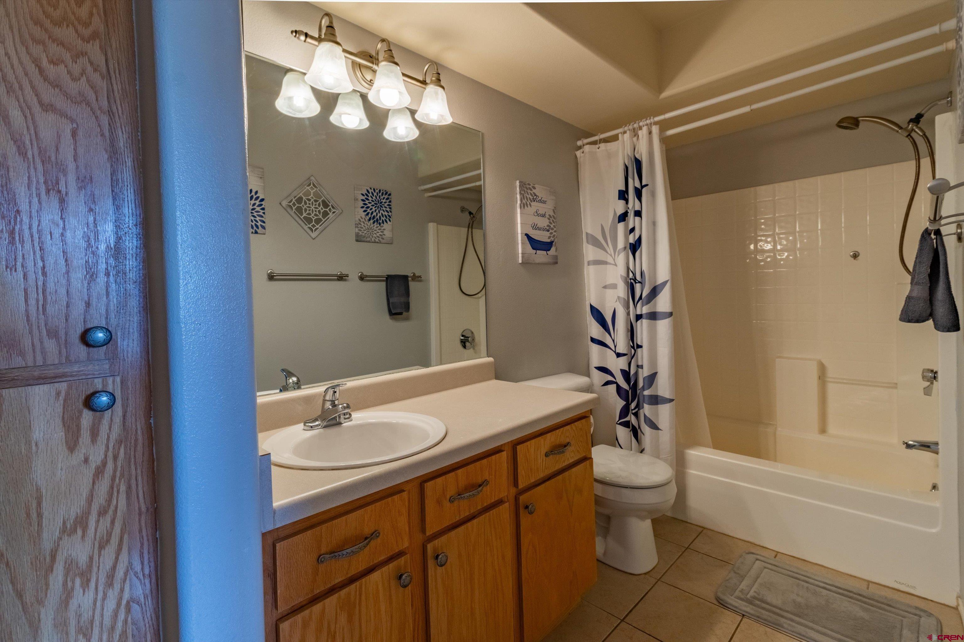 1100 Goeglein Gulch Road, Unit 235 Durango, CO 81301 - Photo 12 of 29 a bathroom with a sink toilet tub and shower