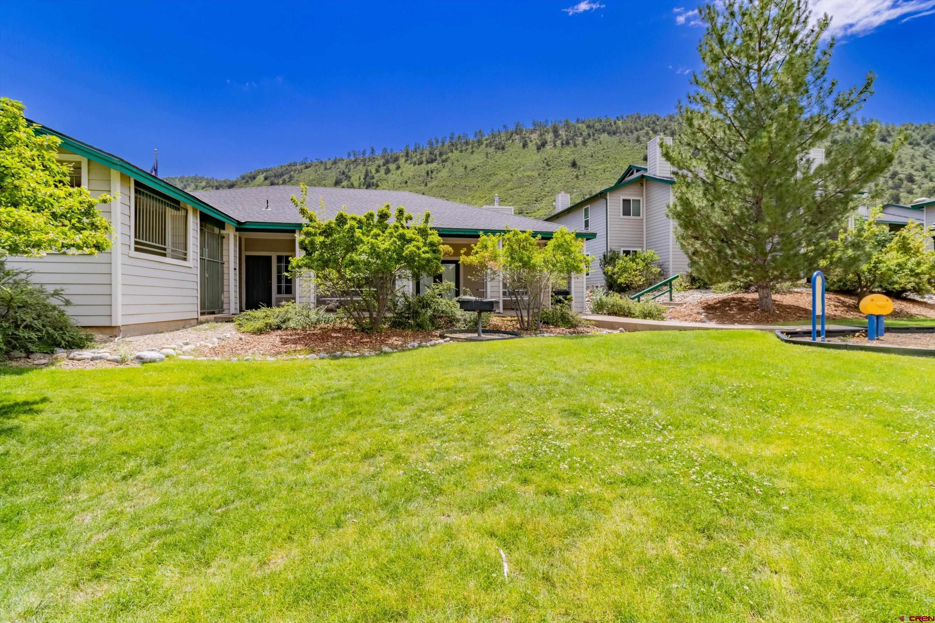 1100 Goeglein Gulch Road, Unit 235 Durango, CO 81301 - Photo 25 of 29 a view of a house with a big yard