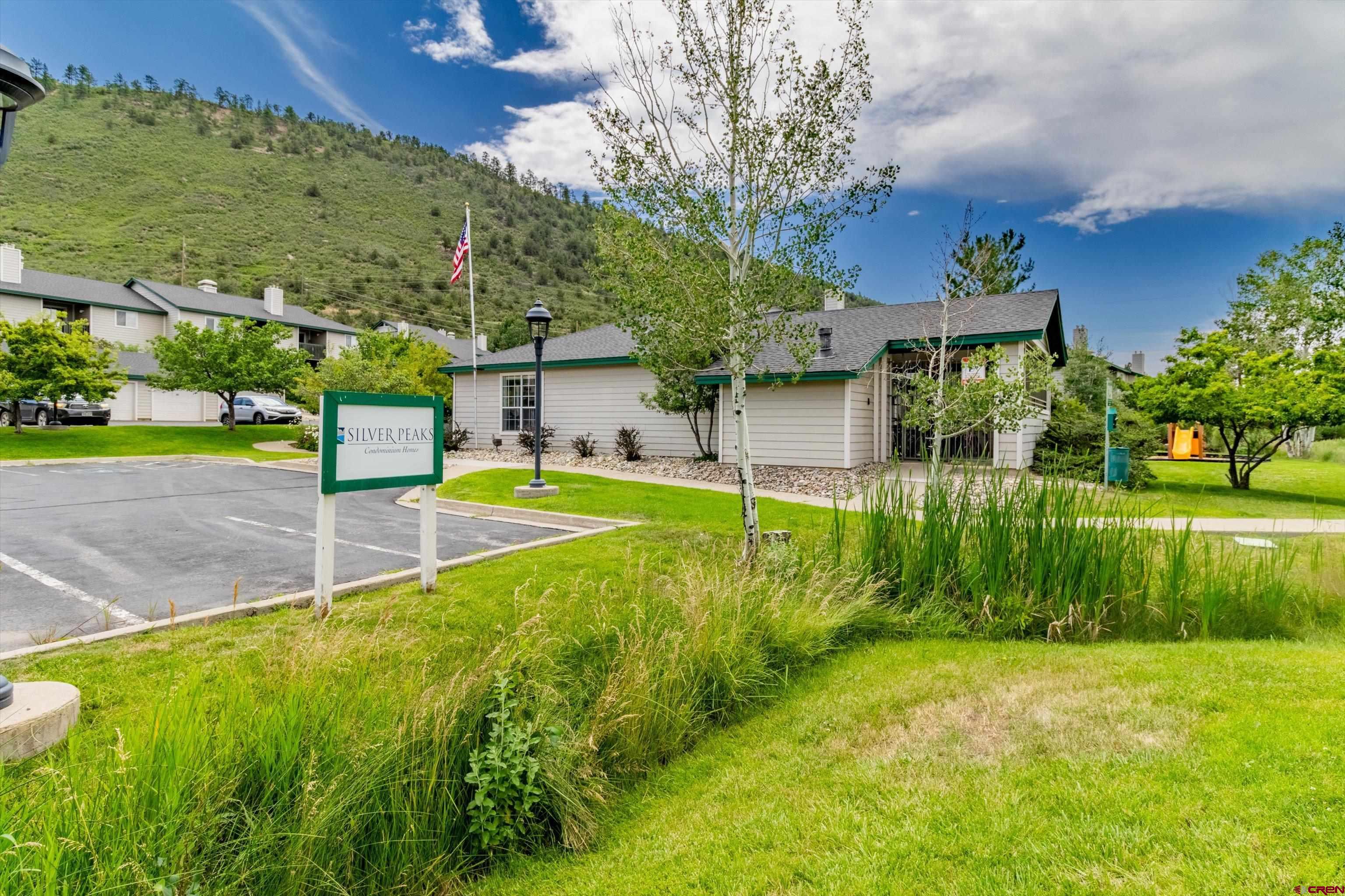 1100 Goeglein Gulch Road, Unit 235 Durango, CO 81301 - Photo 3 of 29 a view of a house with pool and a big yard