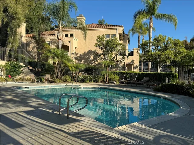 a view of a swimming pool with a patio