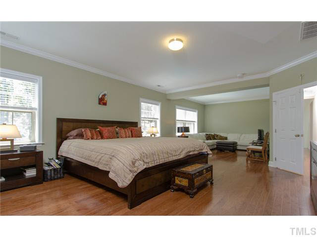 200 Swift Creek Crossing Durham, NC 27713 - Photo 13 of 25 a bed sitting in a bedroom next to a window