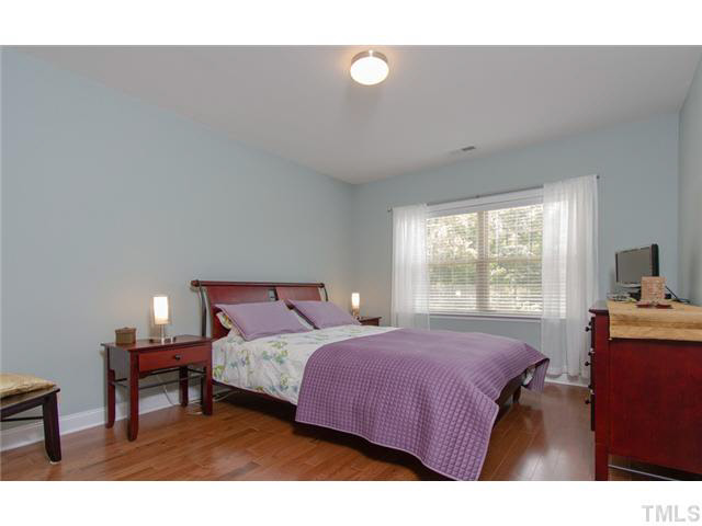 200 Swift Creek Crossing Durham, NC 27713 - Photo 16 of 25 a bedroom with a bed and window