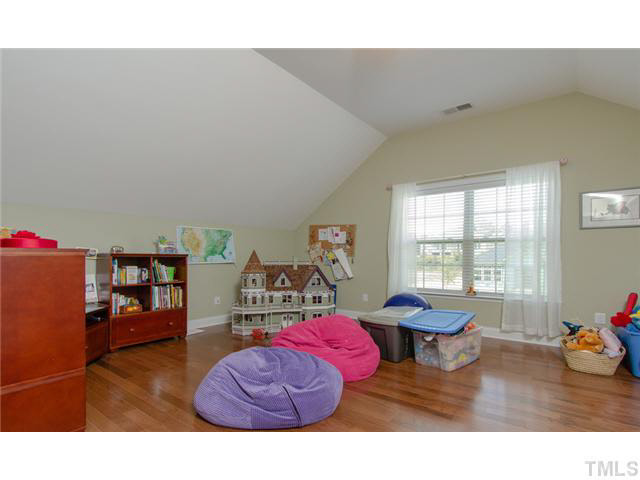200 Swift Creek Crossing Durham, NC 27713 - Photo 17 of 25 a living room with furniture and a wooden floor