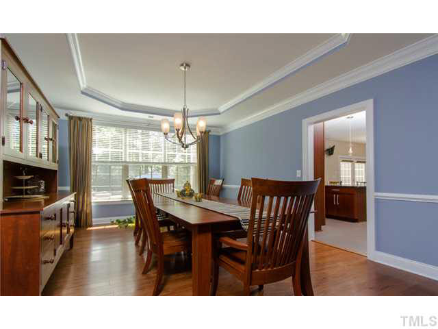 200 Swift Creek Crossing Durham, NC 27713 - Photo 8 of 25 a view of a dining room with furniture window and wooden floor