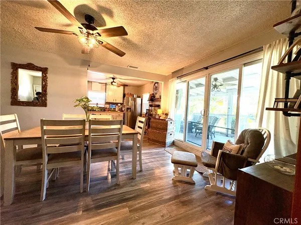 a living room with furniture and floor to ceiling windows
