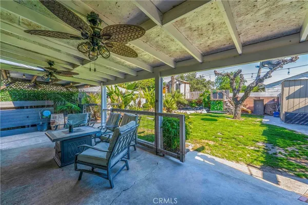 a view of yard with patio