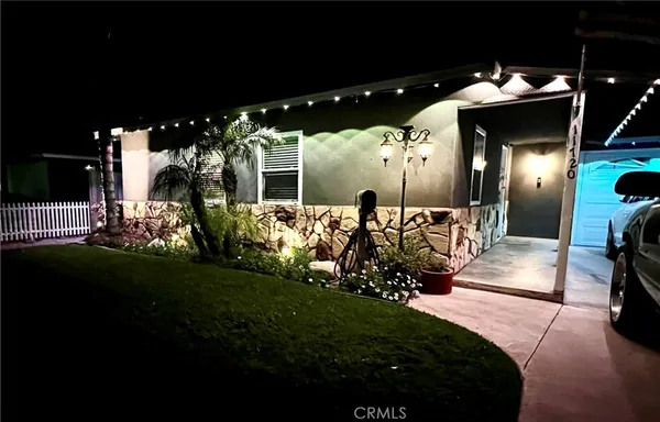 a view of a porch with dining table and chairs with plants