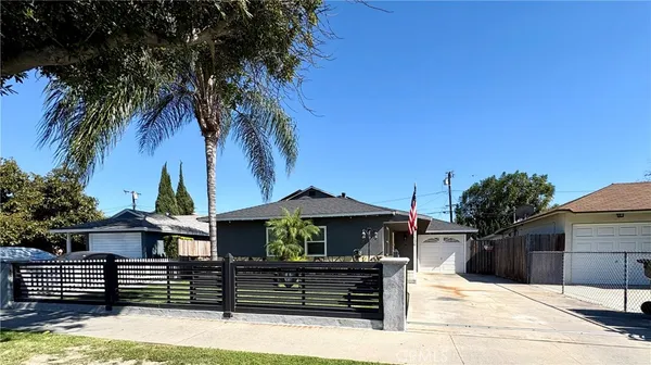a view of house with yard and entertaining space