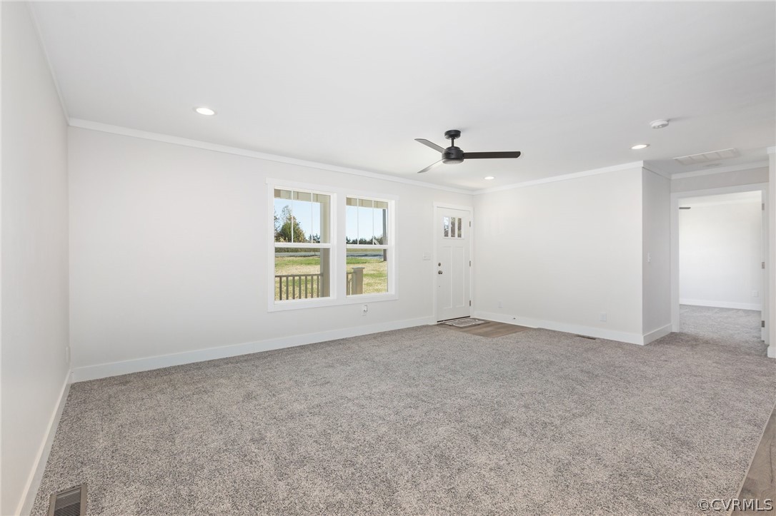 1551 Meherrin Road Meherrin, VA 23954 - Photo 7 of 46 an empty room with windows and ceiling fan