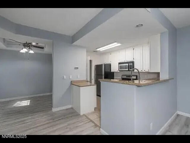 900 South Meadows Parkway, Unit 2012 Reno, NV 89521 - Photo 3 of 3 a view of kitchen with stainless steel appliances refrigerator sink and cabinets
