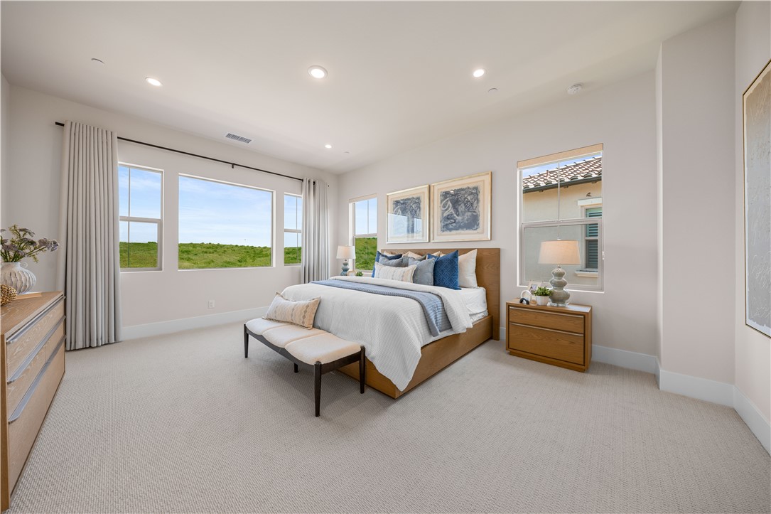 122 Mossvine Irvine, CA 92618 - Photo 23 of 44 a bed room with a bed and a couch