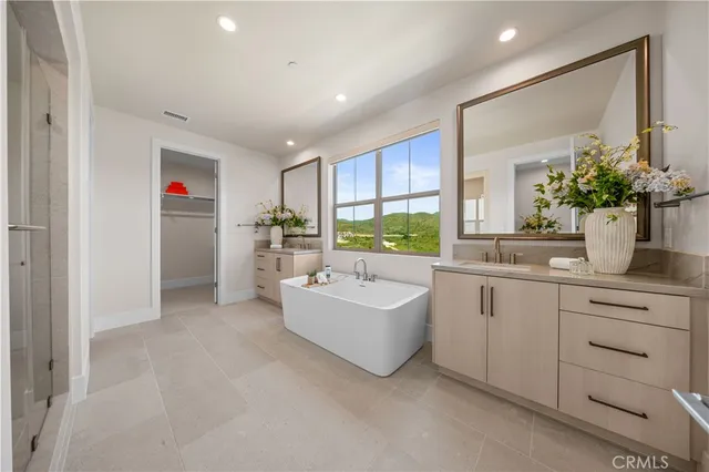 a living room with kitchen island furniture and a sink