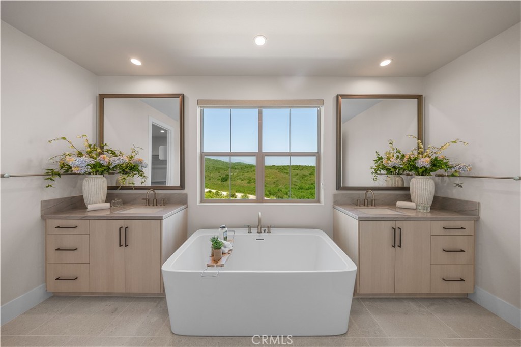 122 Mossvine Irvine, CA 92618 - Photo 31 of 44 a white bath tub sitting in a bathroom