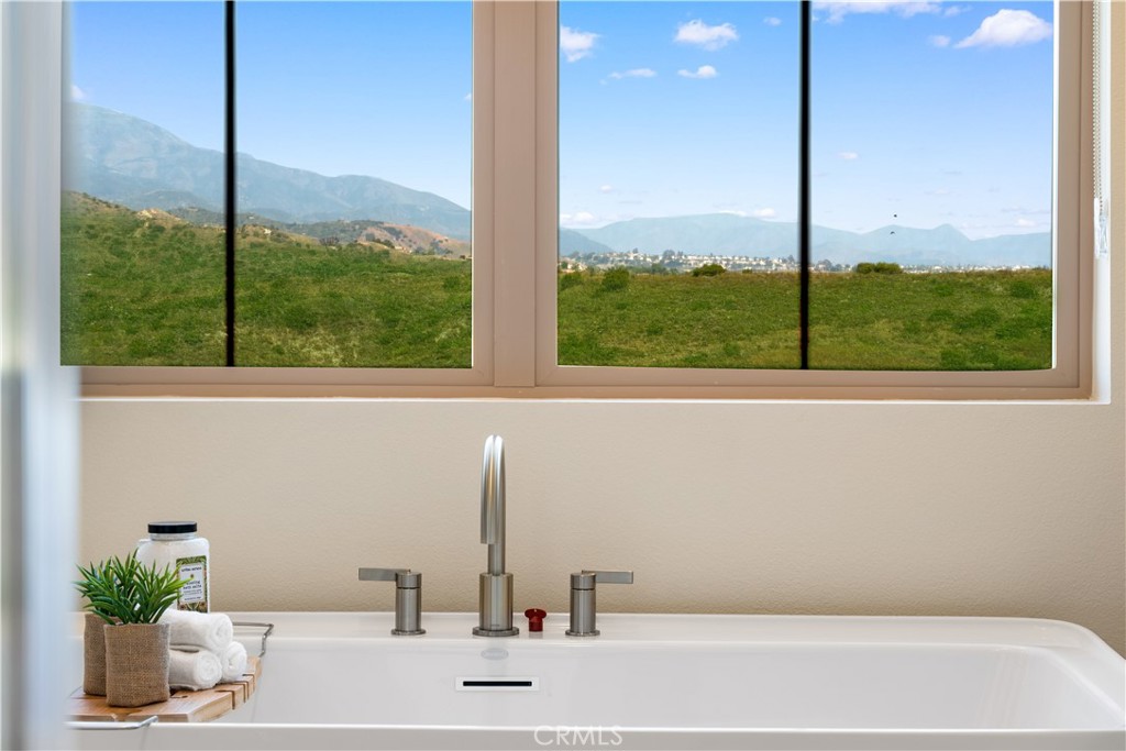 122 Mossvine Irvine, CA 92618 - Photo 33 of 44 a bathroom with a large window and a sink