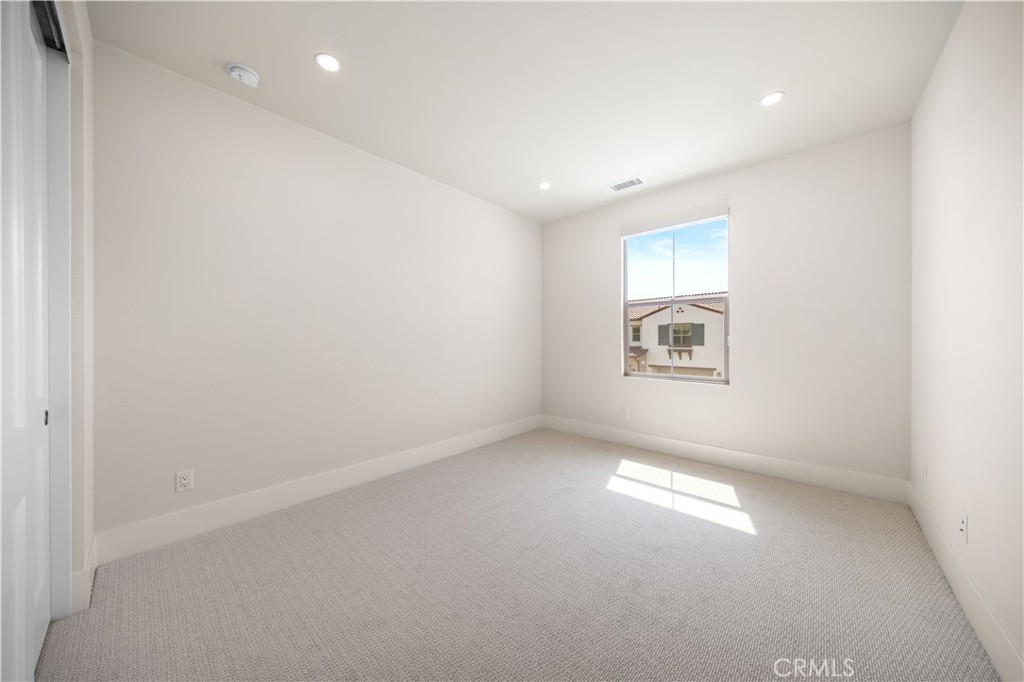 122 Mossvine Irvine, CA 92618 - Photo 34 of 44 an empty room with a empty space and windows