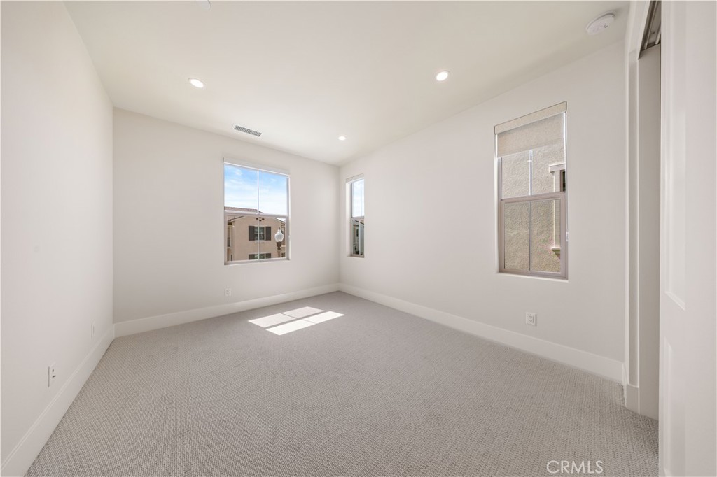 122 Mossvine Irvine, CA 92618 - Photo 36 of 44 a view of an empty room with a window