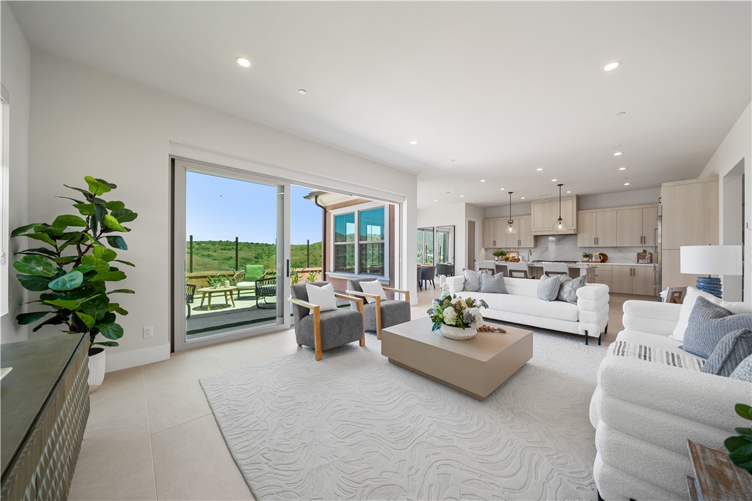 122 Mossvine Irvine, CA 92618 - Photo 6 of 44 a living room with furniture and a potted plant