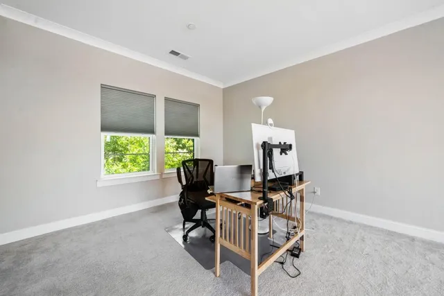 a workspace with furniture and a window