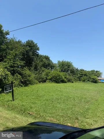 a view of a yard with a table and chair