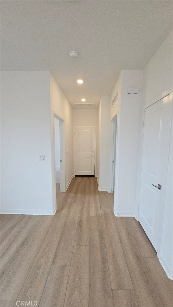 3256 Sprout Paseo Ontario, CA 91761 - Photo 14 of 44 a view of empty room with wooden floor