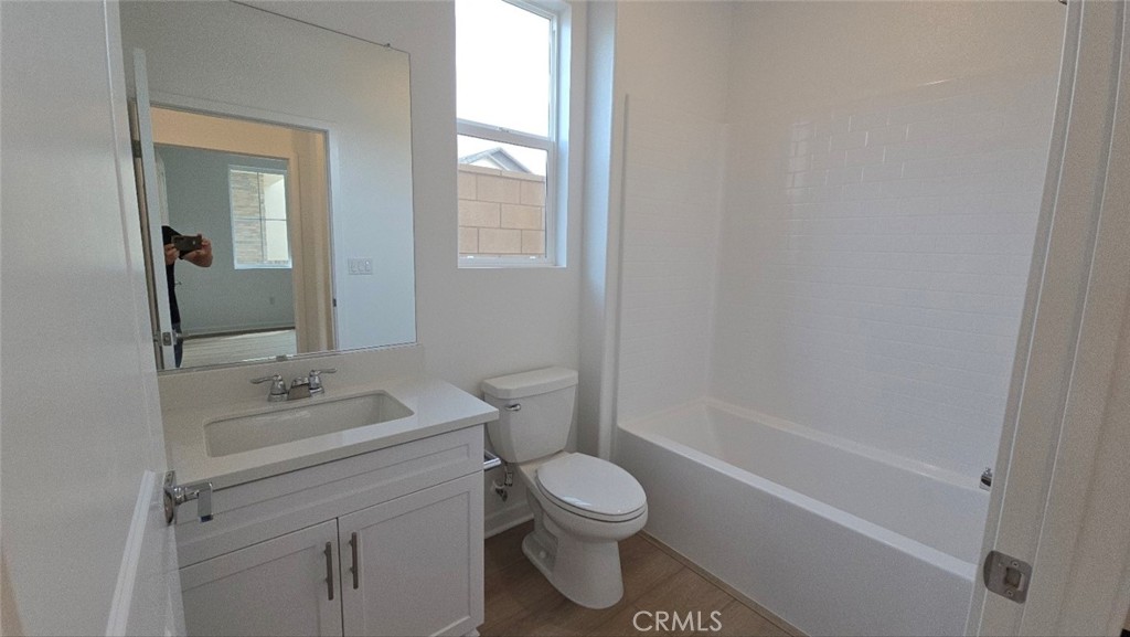 3256 Sprout Paseo Ontario, CA 91761 - Photo 15 of 44 a bathroom with a sink toilet and shower