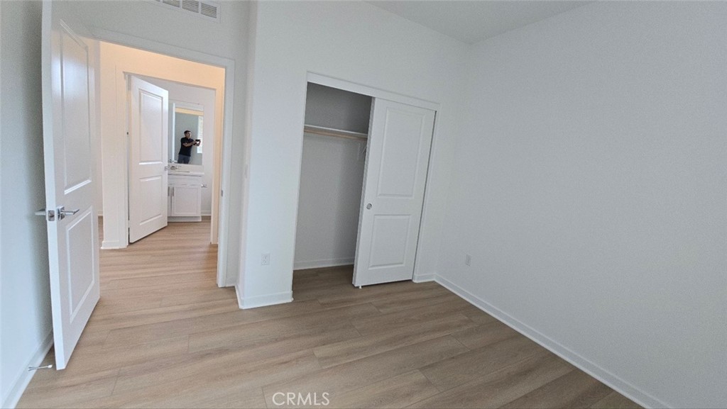 3256 Sprout Paseo Ontario, CA 91761 - Photo 16 of 44 wooden floor in a hall with an empty room