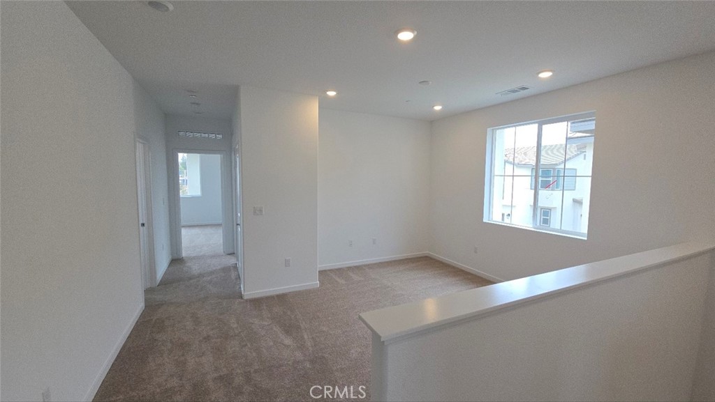 3256 Sprout Paseo Ontario, CA 91761 - Photo 20 of 44 an empty room with windows and closet