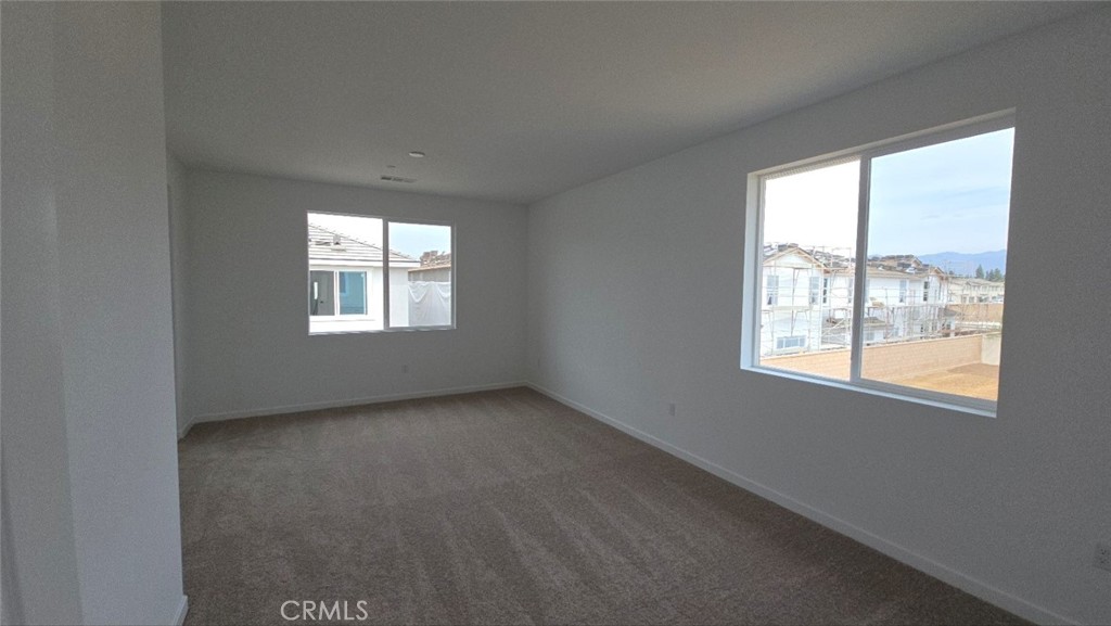 3256 Sprout Paseo Ontario, CA 91761 - Photo 21 of 44 an empty room with windows
