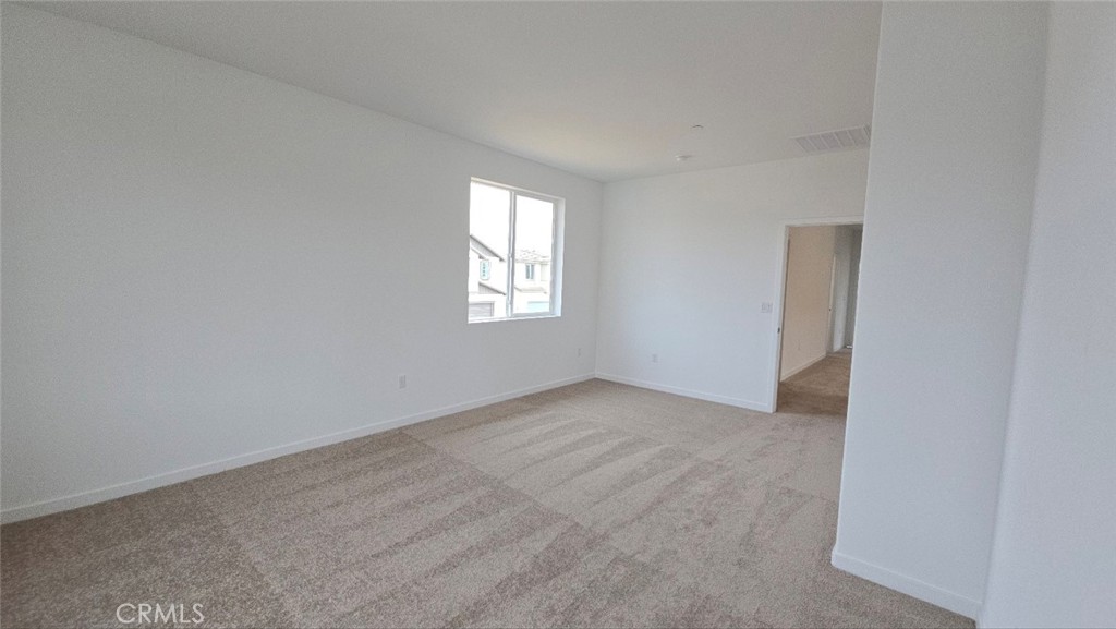 3256 Sprout Paseo Ontario, CA 91761 - Photo 27 of 44 an empty room with windows
