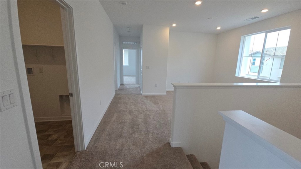 3256 Sprout Paseo Ontario, CA 91761 - Photo 28 of 44 a view of hallway with windows
