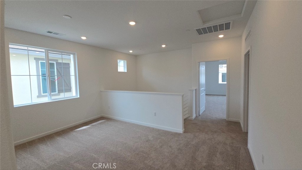 3256 Sprout Paseo Ontario, CA 91761 - Photo 32 of 44 en empty room with windows and closet