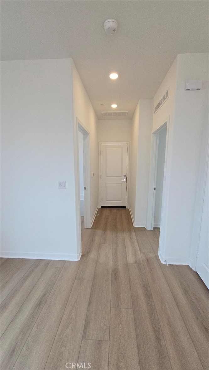 3256 Sprout Paseo Ontario, CA 91761 - Photo 34 of 44 a view of a room with wooden floor