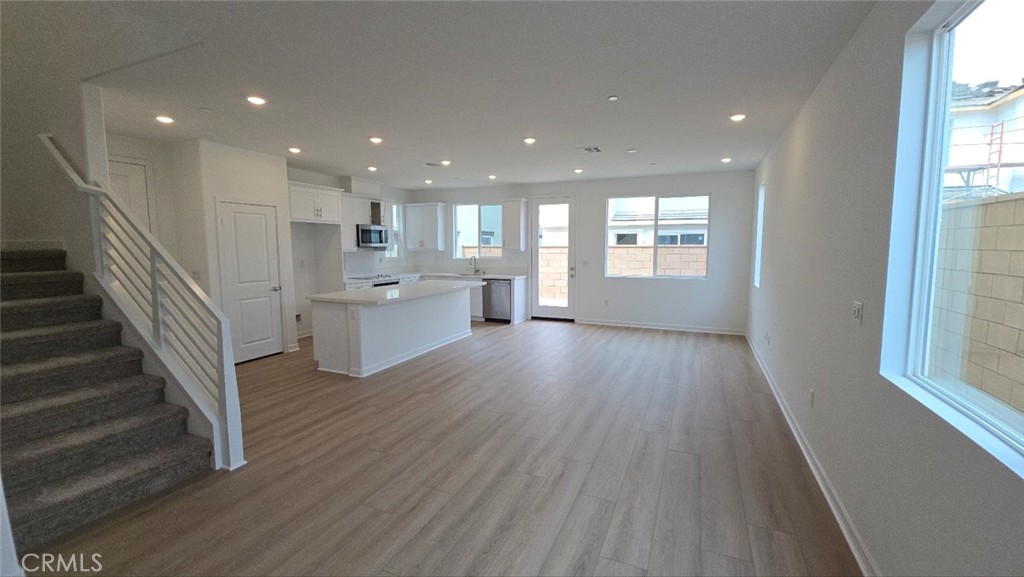 3256 Sprout Paseo Ontario, CA 91761 - Photo 35 of 44 a view of a kitchen and wooden floor