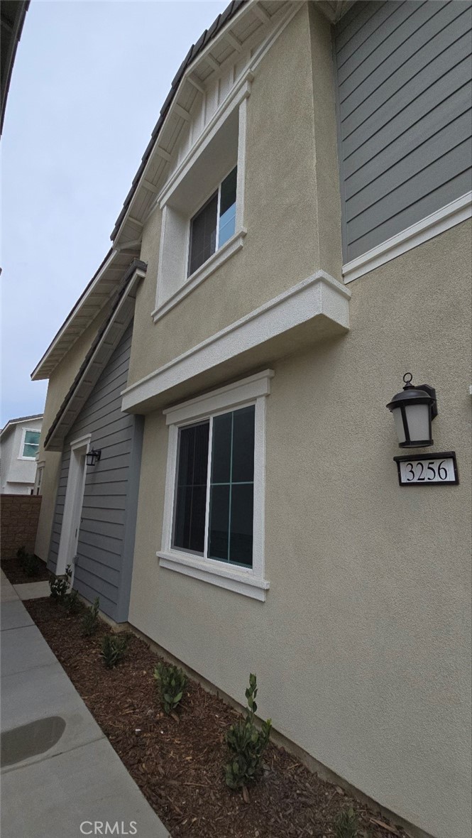 3256 Sprout Paseo Ontario, CA 91761 - Photo 38 of 44 a view of a house with a garage