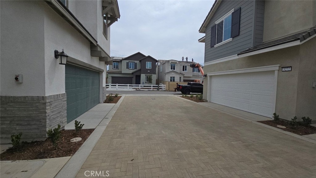 3256 Sprout Paseo Ontario, CA 91761 - Photo 42 of 44 a front view of a house with yard