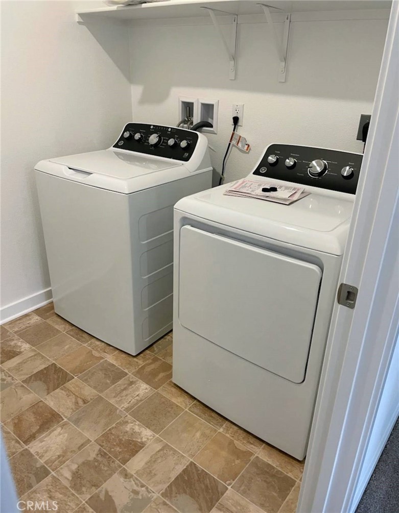 3256 Sprout Paseo Ontario, CA 91761 - Photo 43 of 44 a utility room with dryer and washer