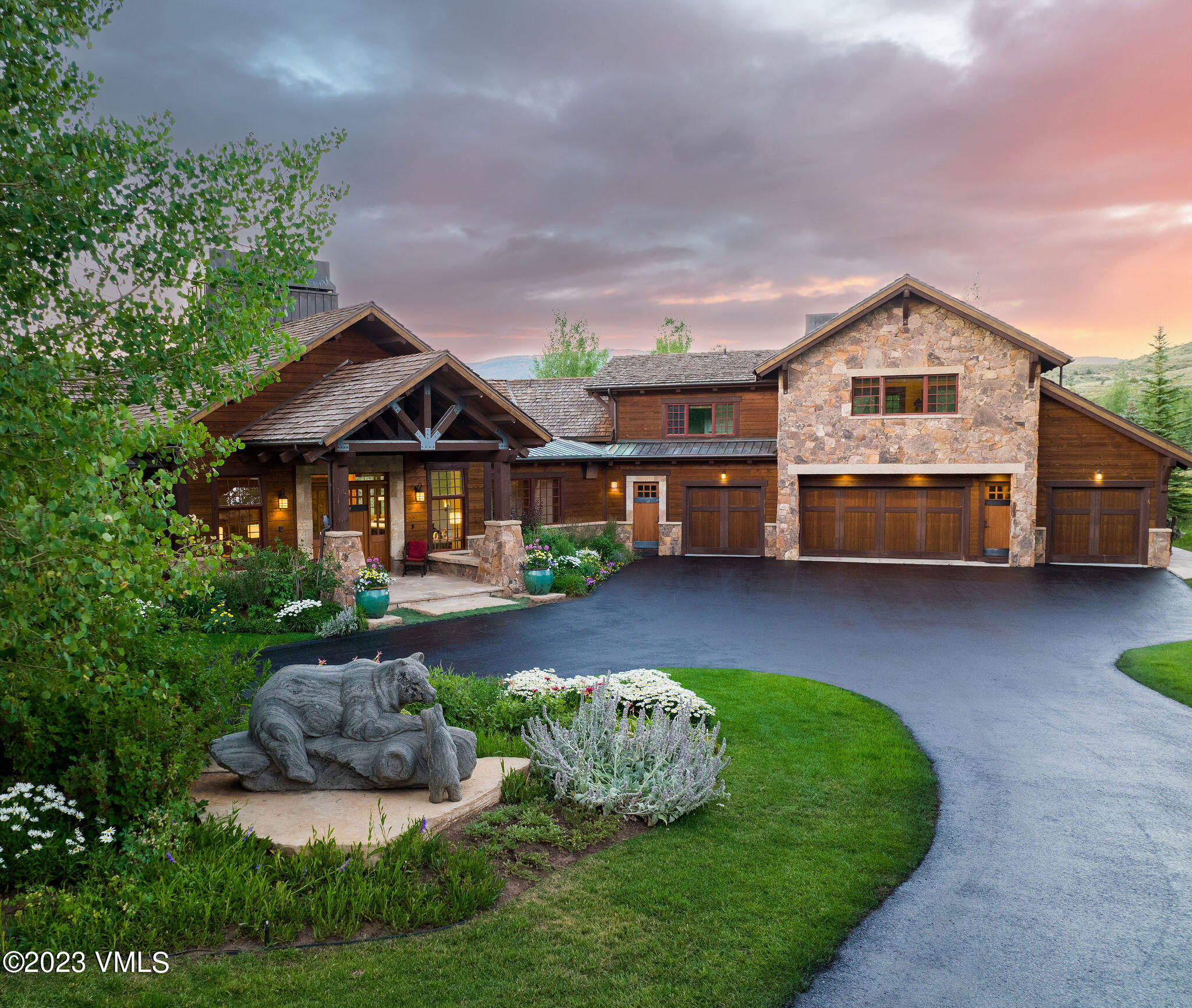 520 Old Creamery Road Edwards, CO 81632 - Photo 1 of 78 a front view of a house with a garden and plants