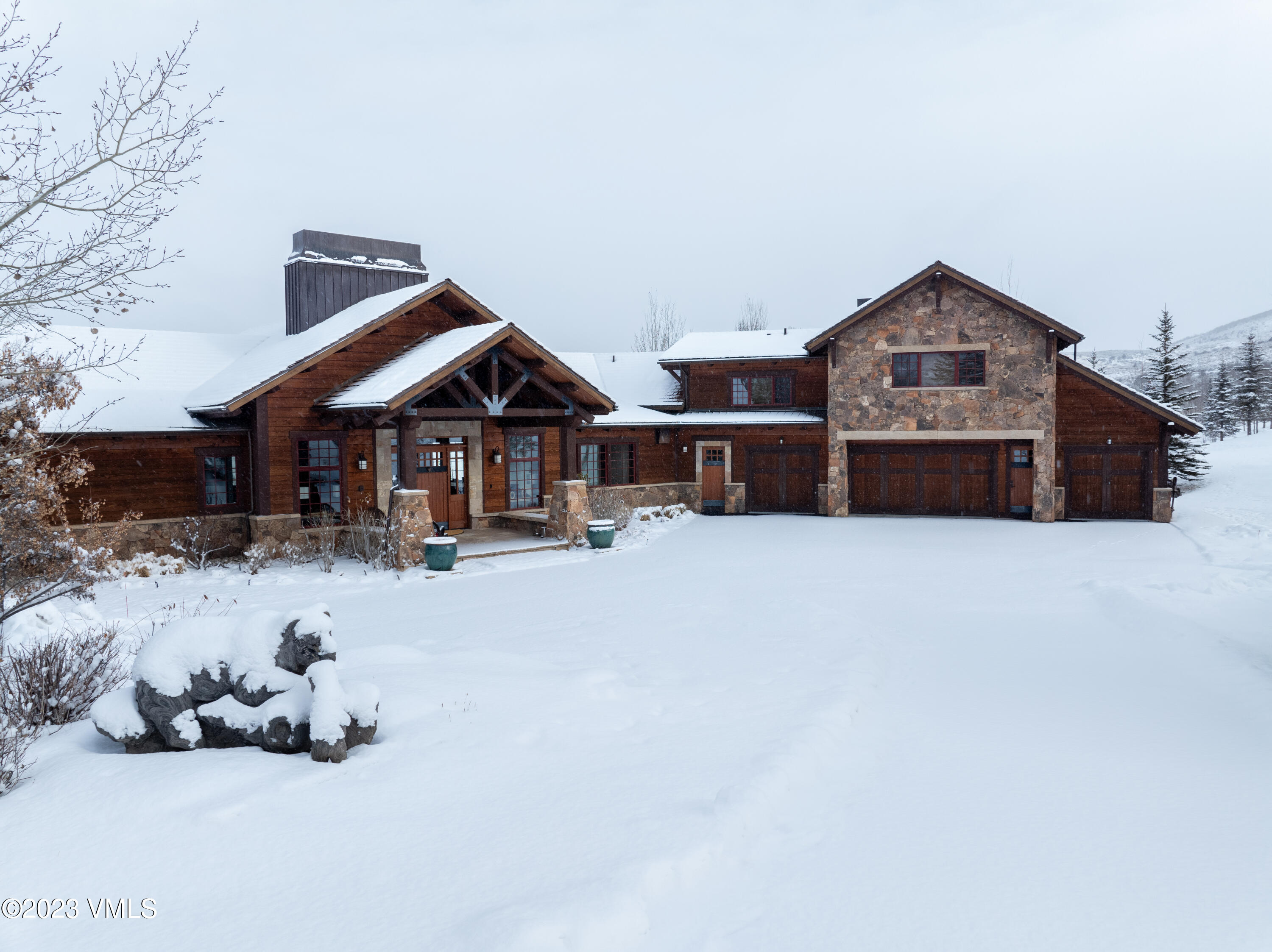 520 Old Creamery Road Edwards, CO 81632 - Photo 2 of 78 a front view of a house with yard and garage
